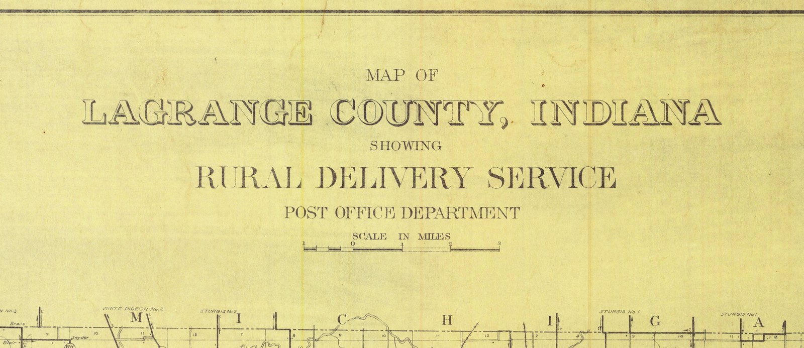 The title cartouche at the top center of the 1909 rural delivery map of LaGrange County, under the sheet's top border line. It is lettered Map of LaGrange County, Indiana, showing Rural Delivery Service, Post Office Department, with a scale in miles beneath. Along the bottom is the top edge of the county map, the state line with Michigan lettered along it and route labels for White Pigeon and Sturgis.